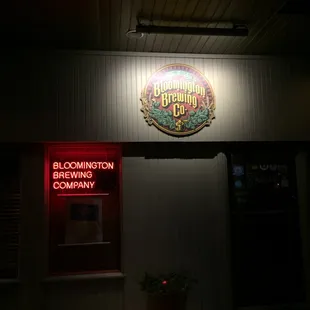 a neon sign on the outside of a building