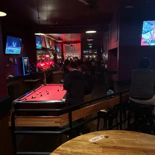 a pool table in the middle of the room