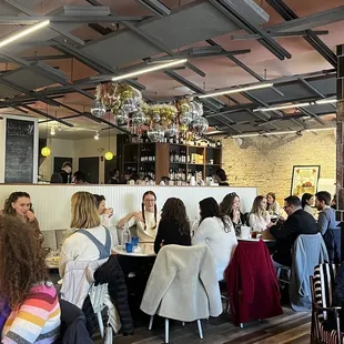 a large group of people sitting at tables