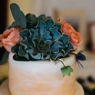 cake flowers, greens, and thistles