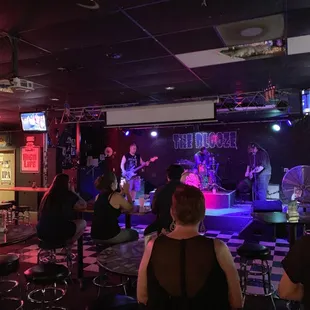 a group of people sitting in a bar