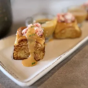 Maine Lobster Rolls: Traditional lobster salad, buttered brioche, shot of bisque ($24)