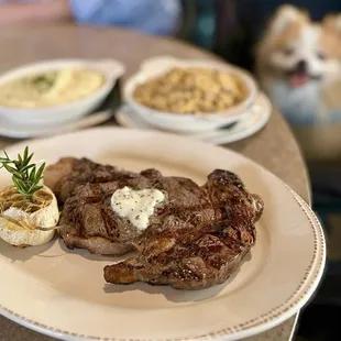 Ribeye: 16 oz certified angus beef prime, herbed compound butter ($52), Mashed Potatoes ($8), Charred Corn ($9)