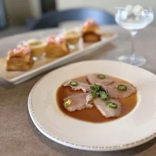 Hamachi Crudo w/ citrus soy dressing, serrano, cilantro ($20) - Skip!