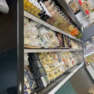 a display of cheeses and other foods