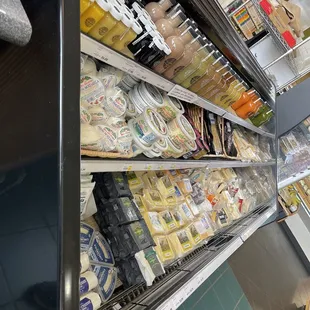 a variety of dairy products in a grocery store