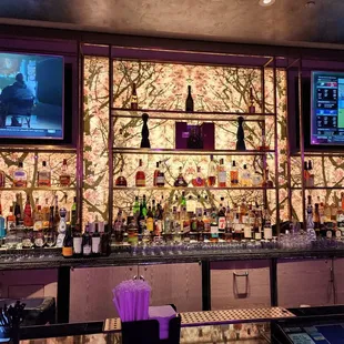 a bar with a variety of liquors