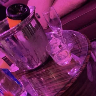 a glass of wine and ice bucket