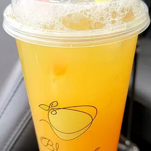 Fresh Pineapple tea with mango popping boba