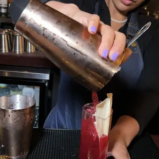 The owner and award winning mixologist, Lisa serving up one of Blossom&apos;s signature cocktails &quot;Good Kisser&quot; (Tequila &amp; Hibiscus Tea)