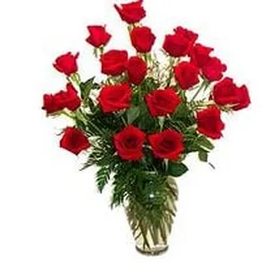 a vase of red roses