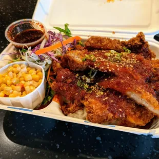 Crispy Chicken Rice. Fried chicken cutlet, homemade BT BBQ sauce, sesame, green onion. Sides: Korean salad, corn salad. $10.50.