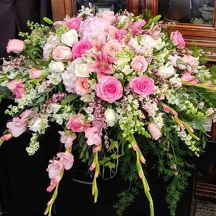 Beautiful all in pink casket spray