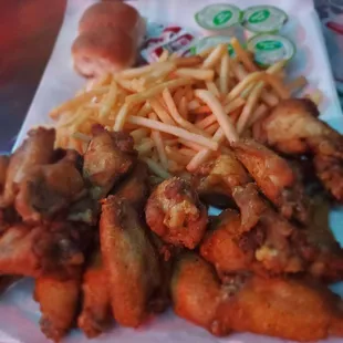 Half Lemon pepper and half seasoned 24pc wing order with fries
