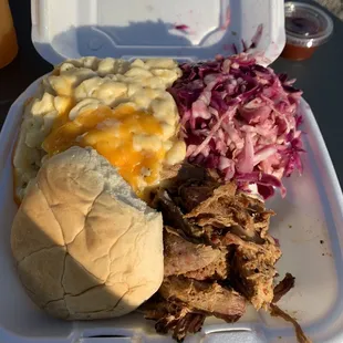 Pulled pork sandwich combo. Amazing Mac and cheese. Slaw