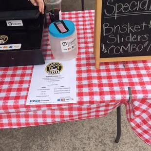 a checkered table cloth and a sign