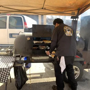 Getting my food from the delicious smelling smoker.