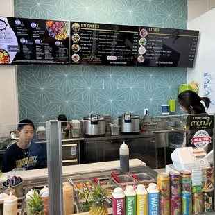 a man and a woman behind the counter