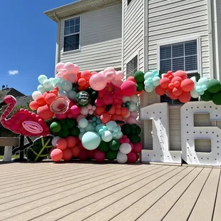 Balloon wall, custom flamingo filled with balloons, number LED marquee, paper flower and custom vinyl add-ons