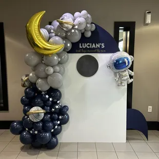 Large arch custom backdrop with balloon garland and Mylar add-ons