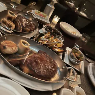 Bone in rib-eye, potato skins, creamed spinach, mushrooms