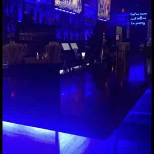 a bar with blue lighting