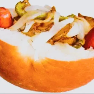 a hot dog with onions and peppers