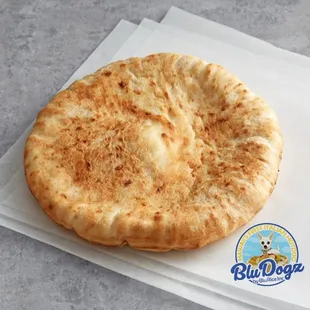 a flat bread on a napkin