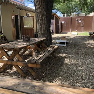 a picnic table under a tree