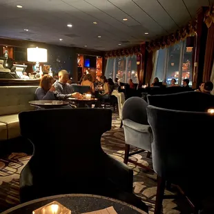 a group of people sitting in a restaurant