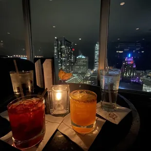 Guido's perfect Manhattan and Smokin' Aces cocktails with a wonderful skyline view