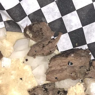 a sandwich with meat and onions