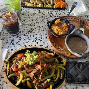 Spicy mango crunch sushi rolls  Carne asada fajitas, rice &amp; beans