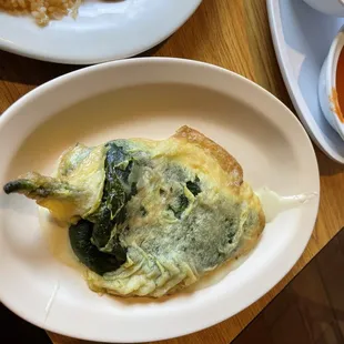 Chili relleno with sauce on side.