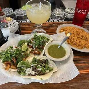 Al pastor tacos with margarita