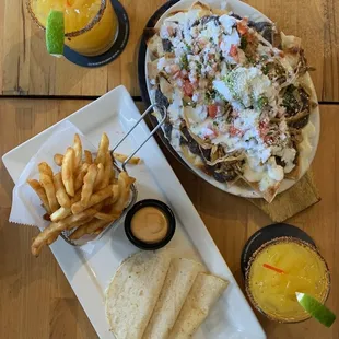 Passion fruit/mango margaritas, nachos with chicken, mini quesadilla and fries