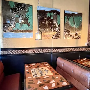 a table and booths in a restaurant