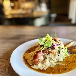a plate of food on a wooden table