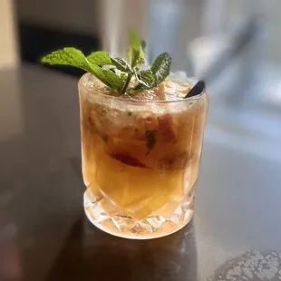 a drink in a glass on a table