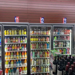 two refrigerators filled with drinks