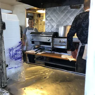 two men in a kitchen