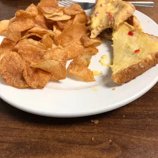 a plate of chips and a sandwich