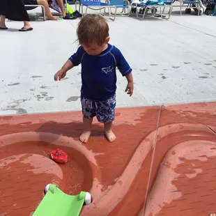 A place for tots to play in running rivers in the concrete.