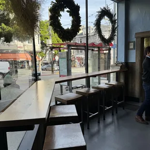 a man standing in front of a window