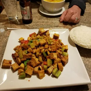 Kung Pao Tofu, side of steamed rice. Egg Drop soup in the background.