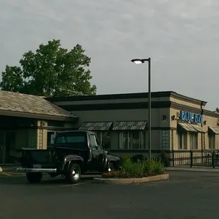 a truck parked in front of the building