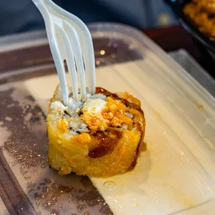 a fork sticking out of a roll