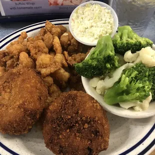 2 crab cakes, fried shrimp, steamed vegetables, with Cole slaw