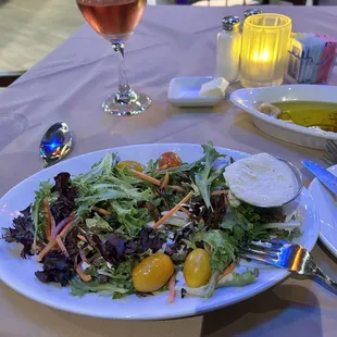 This is the house salad with artichoke dressing.