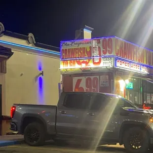 a truck parked in front of the restaurant